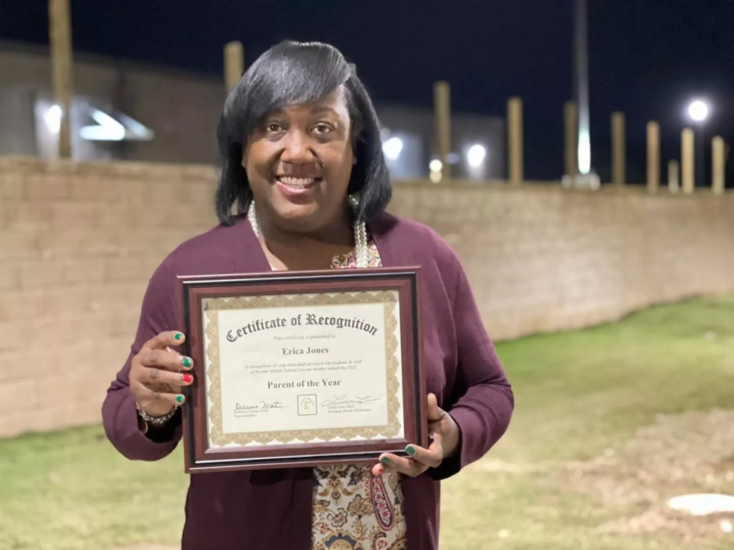 President Erica Jones receives her Parent of the Year Award