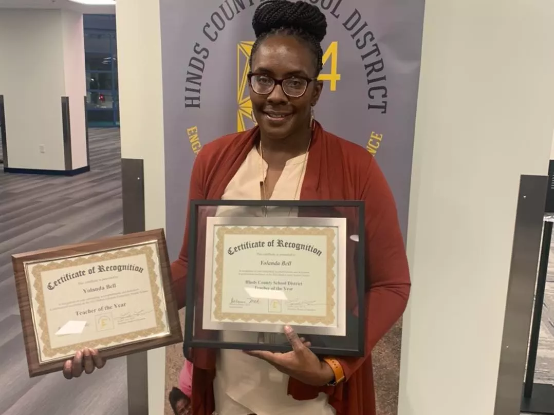 MAE member Yolanda Bell receiving her Teacher of the Year Awards