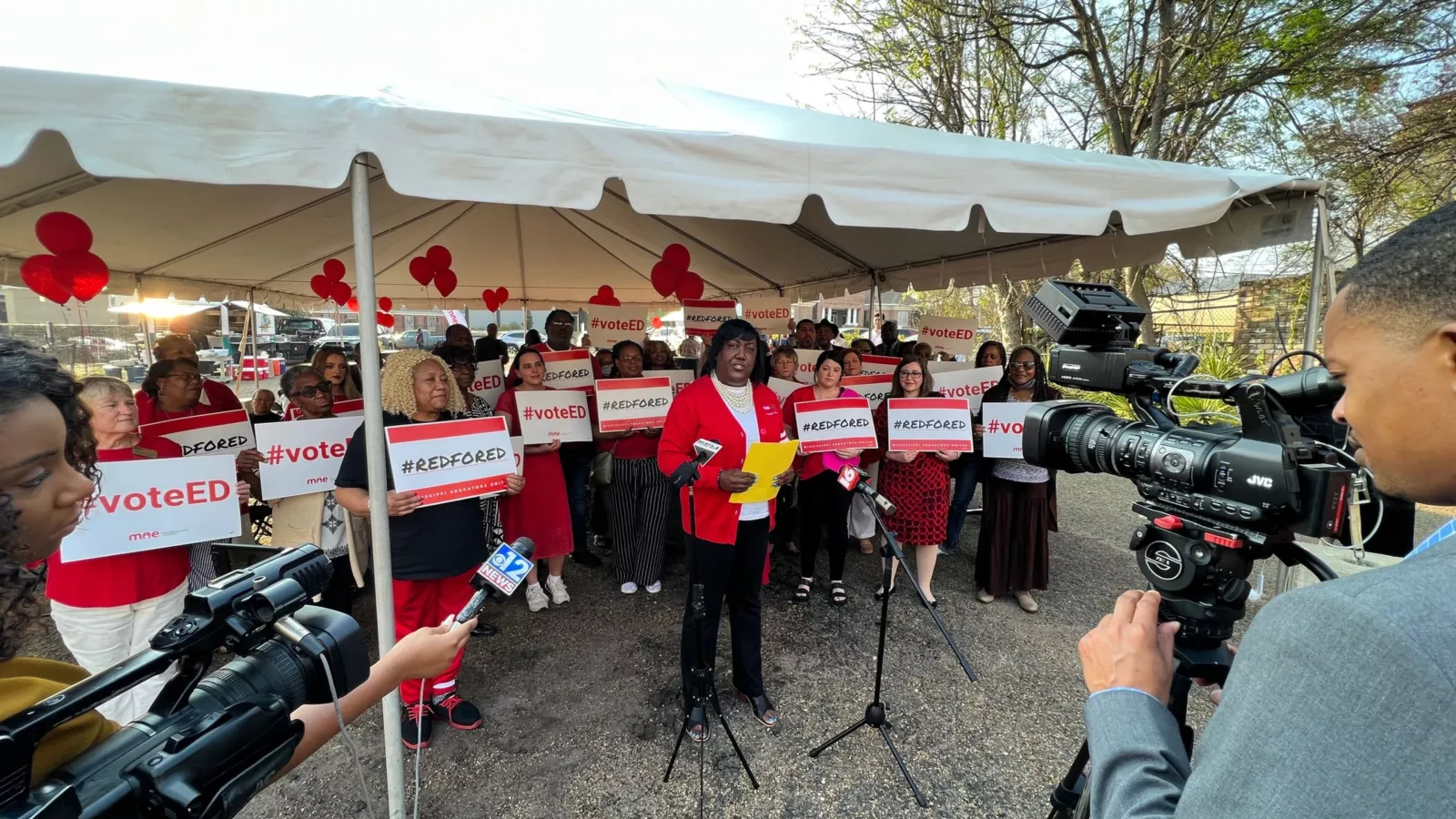 MAE President Erica Jones stands with MAE members to advocate for MS students.