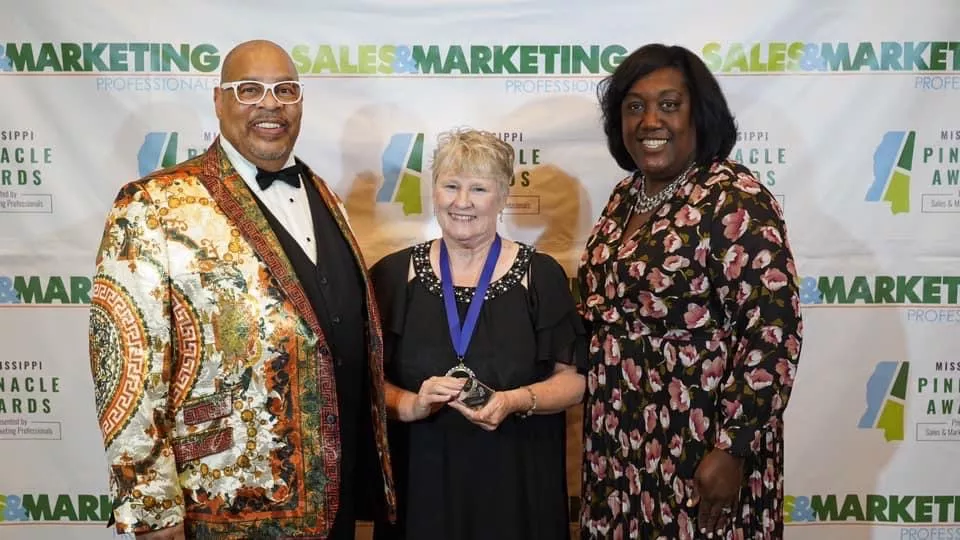 Image is of Chair of the Mississippi Pinnacle Awards, Michael Marks, Pam McLendon, MAE South UniServ Director, MAE President Erica Jones