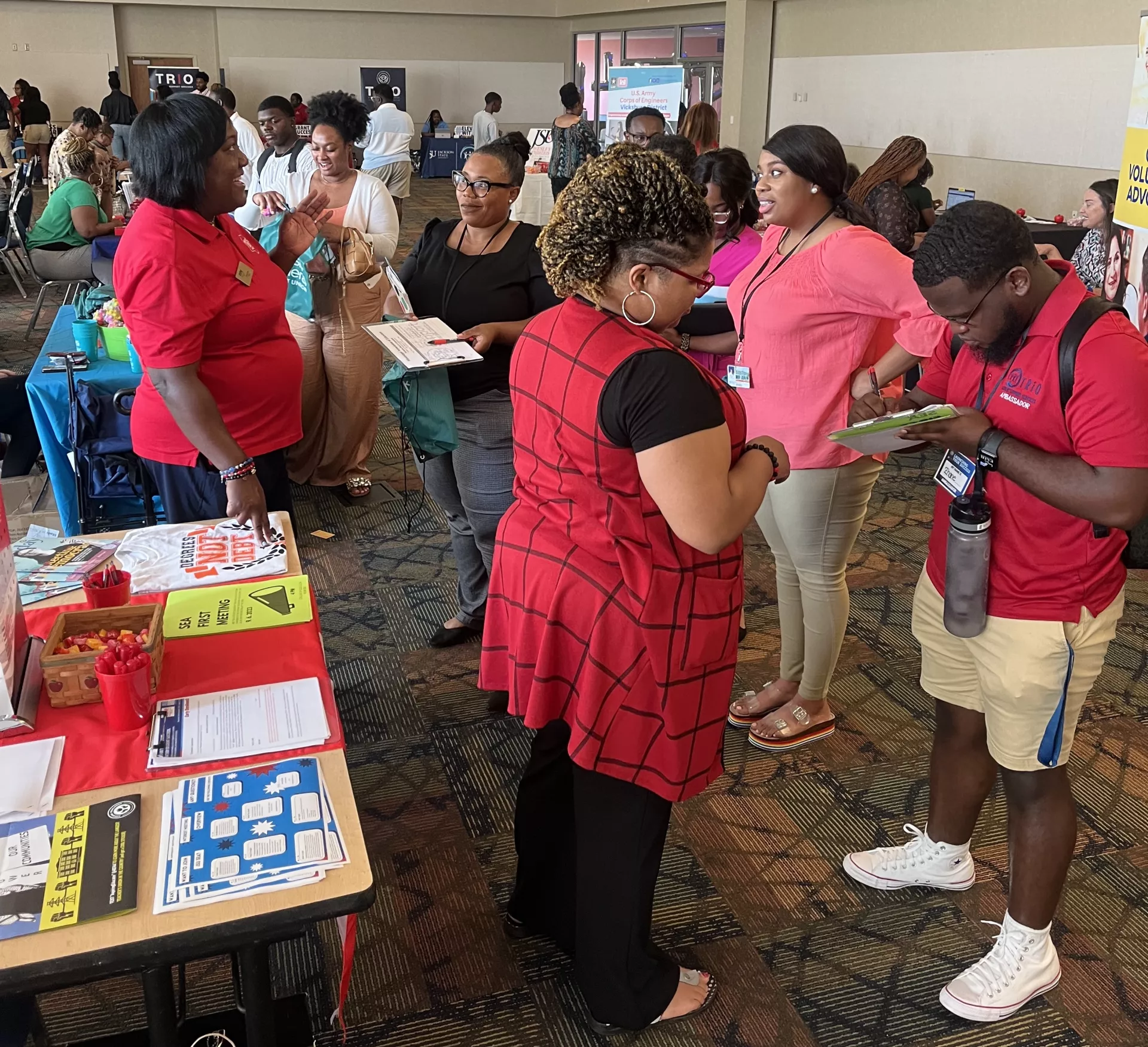 Image is of MAE Members checking their information