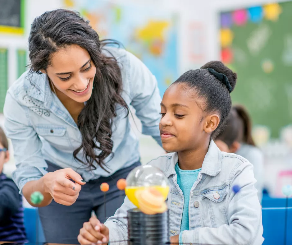 Image is of a teacher and student