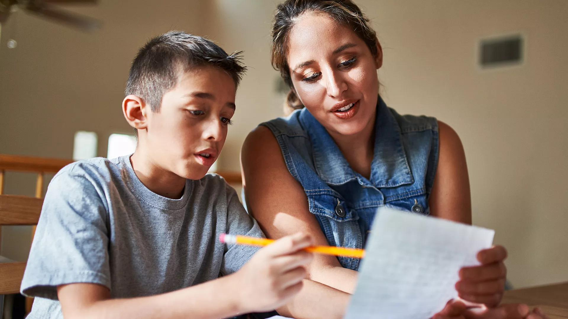 parent helping child to write