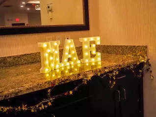 Image is of MAE signage at the Spring 2024 RA