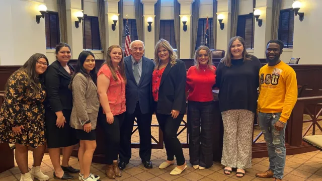 Aspiring Educators pose with a legislator on MAE Lobby Day.