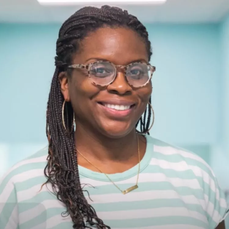 Andrea Watson smiles at the camera.