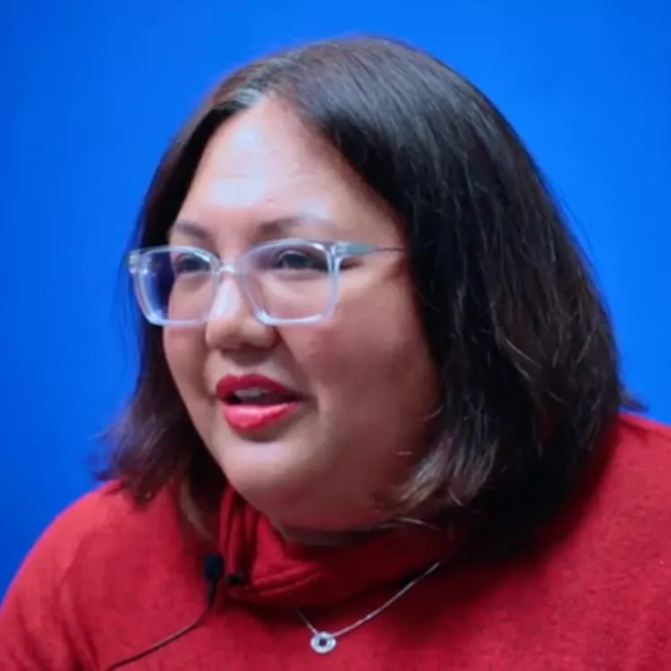 Louise Smith pauses while talking about how important public schools are.
